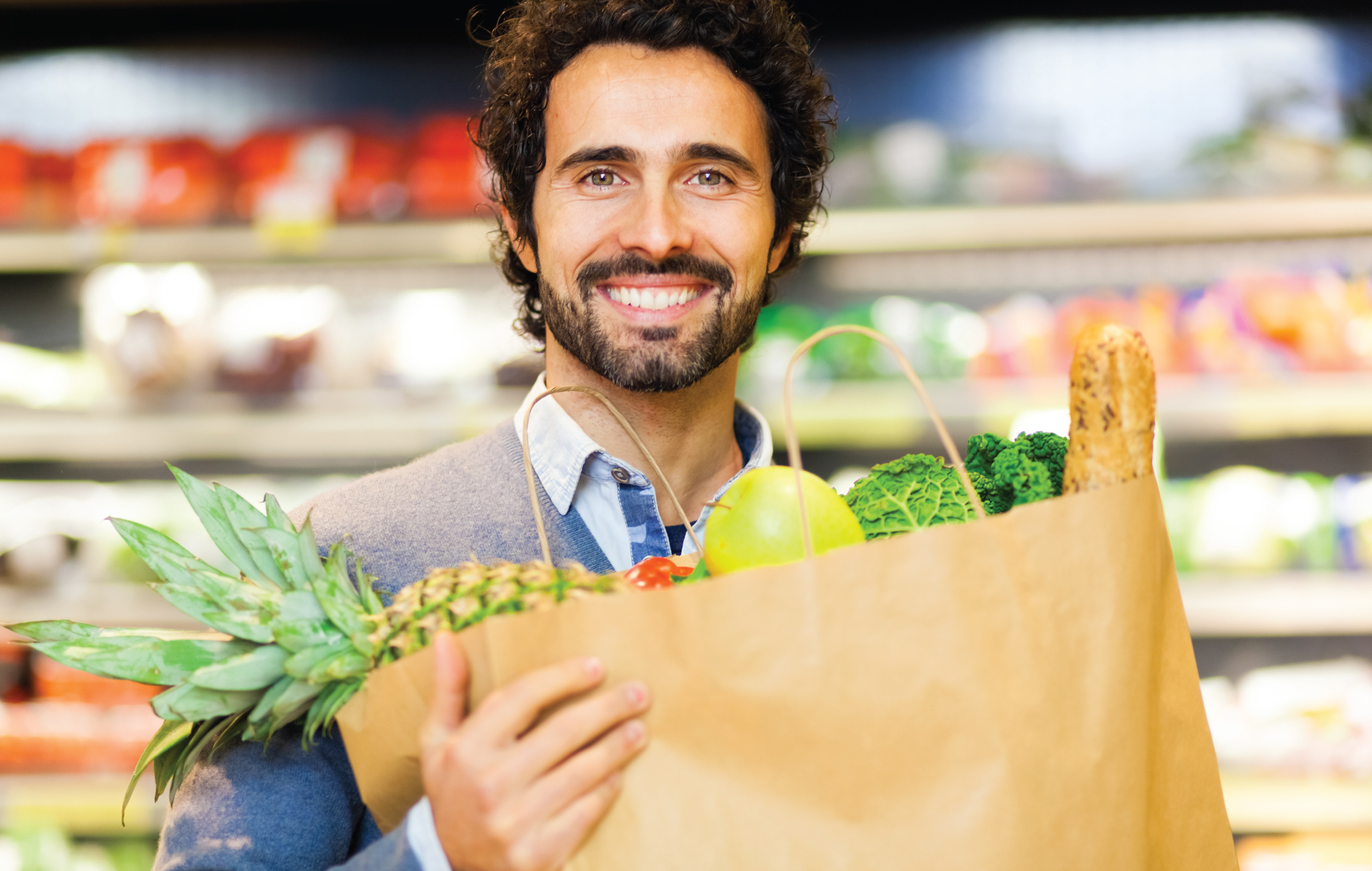 Man holding a bag of groceries